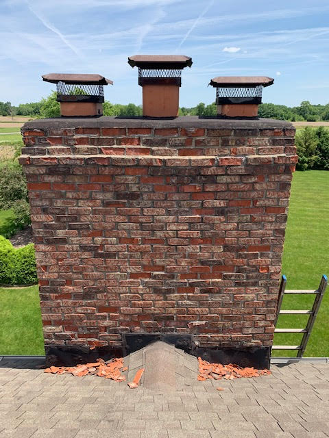 chimney damaged and spalling brick needs repair
