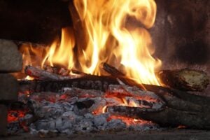 Fireplace with logs burning in a Fishers Indiana home